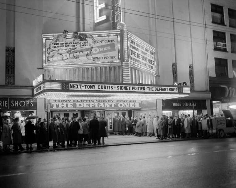 #39 People lined up for the opening of the Defiant Ones at the Vogue Theatre, Vancouver, 1958