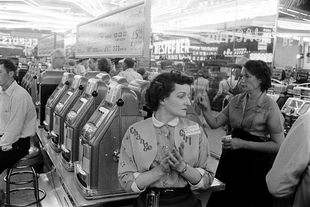 #35 Customers at slot machines, Las Vegas, 1960s.