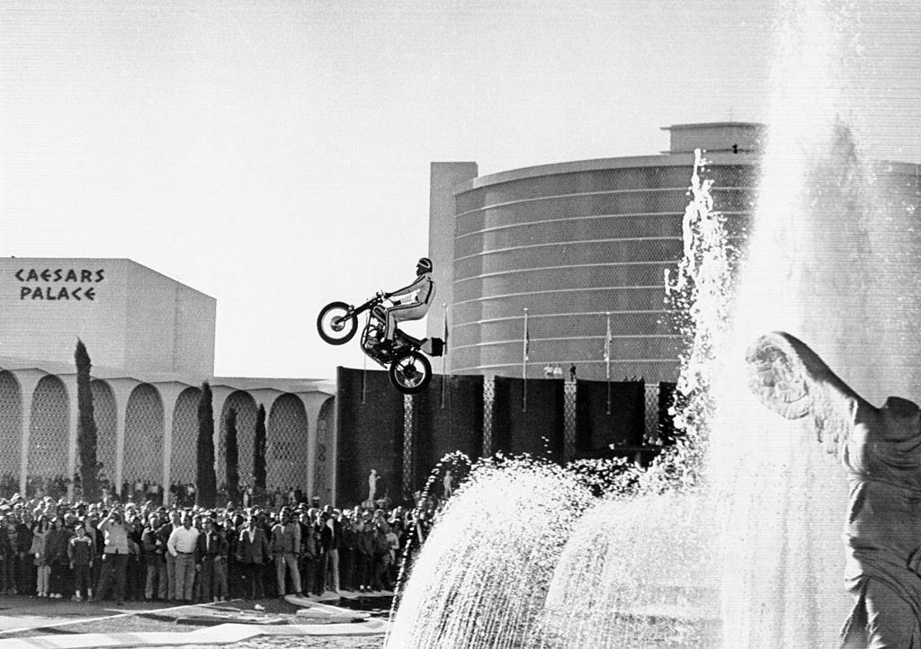 #58 Motorcycle stunt man Evel Knievel jumping over the fountain at Caesars Palace in Las Vegas, 1967.