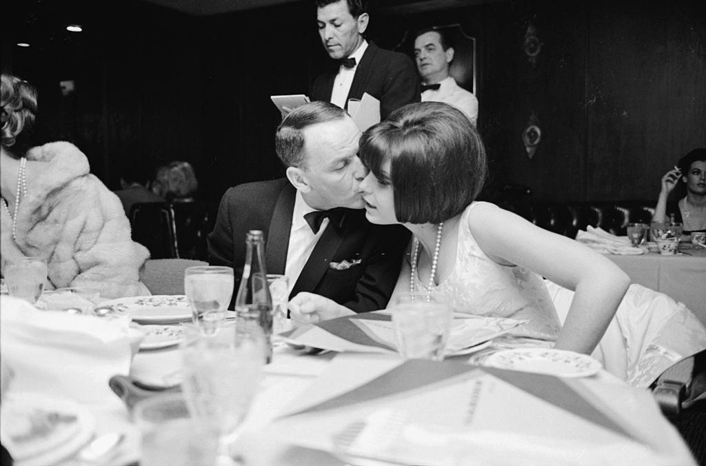 #72 Frank Sinatra kissing her daughter Tina, Las Vegas, 1965.