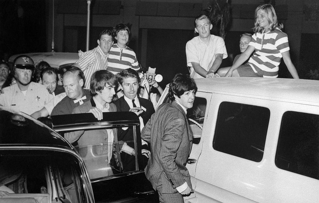 #29 Beatles arriving at the Hotel Sahara through a freight entrance, Las Vegas, 1964.