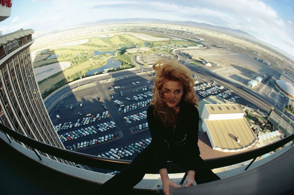 #4 Ann-Margret sits on the railing of a hotel balcony in Las Vegas, 1969.