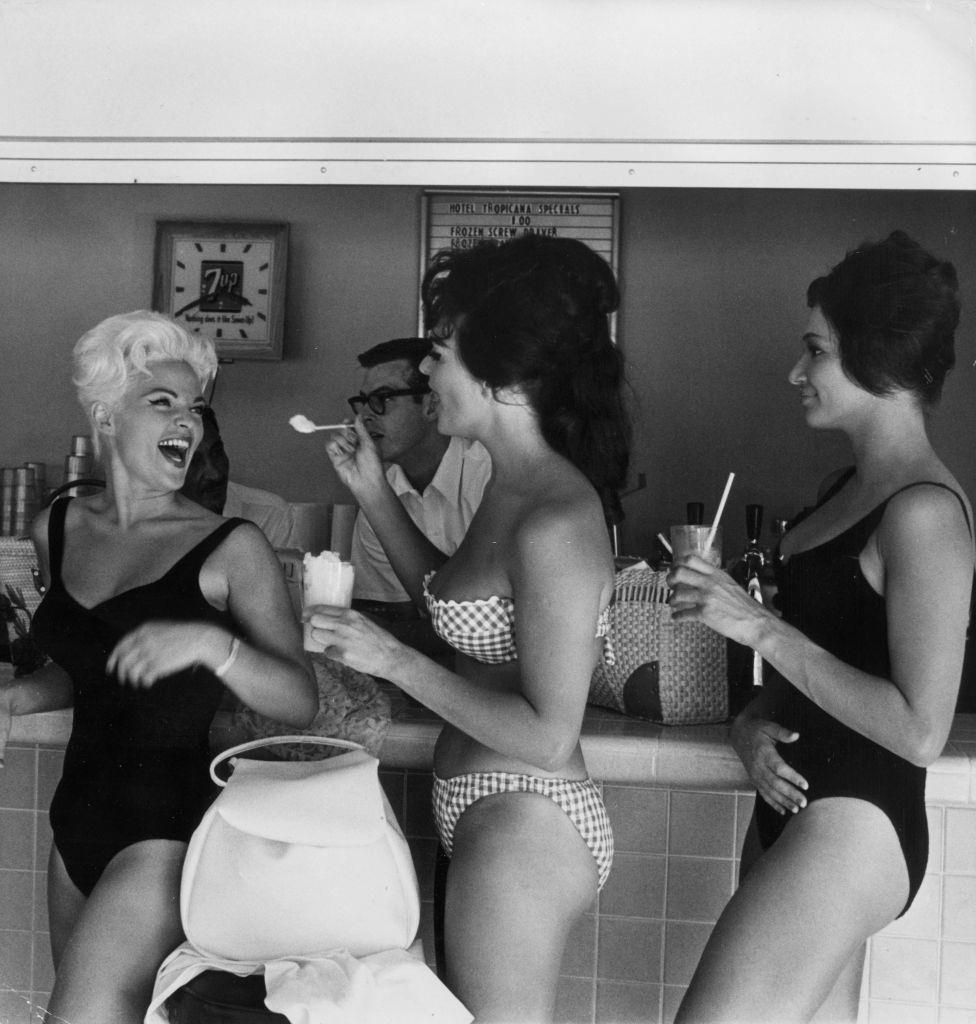 #11 Bathing beauties enjoy iced drinks in a bar in Las Vegas, 1960.
