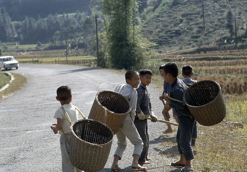 #8 Children at the roadside, carrying baskets, Taiwan, 1969.