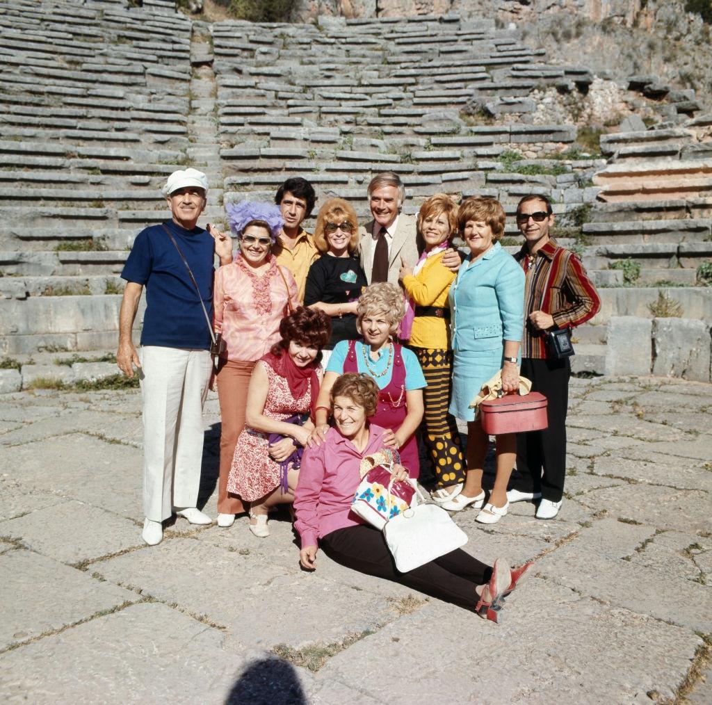 #16 Joachim Fuchsberger poses with friends and colleagues for a group photo, circa 1970s.