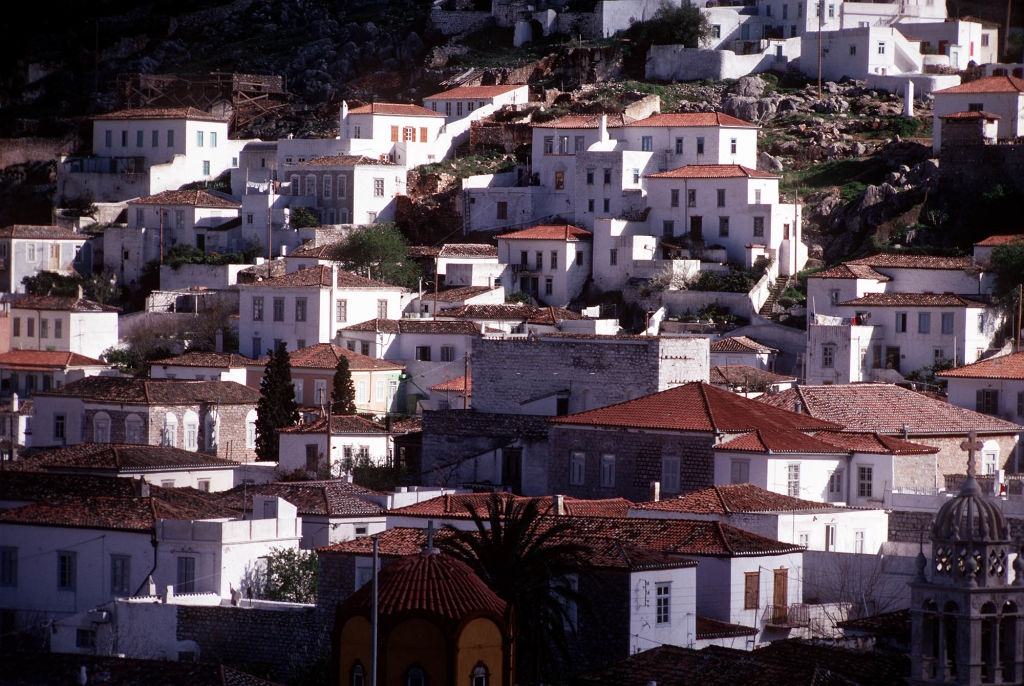 #18 Houses on the hillside above the habour on the Greek island of Hydra, part of the Argo-Saronic group of Aegean islands.