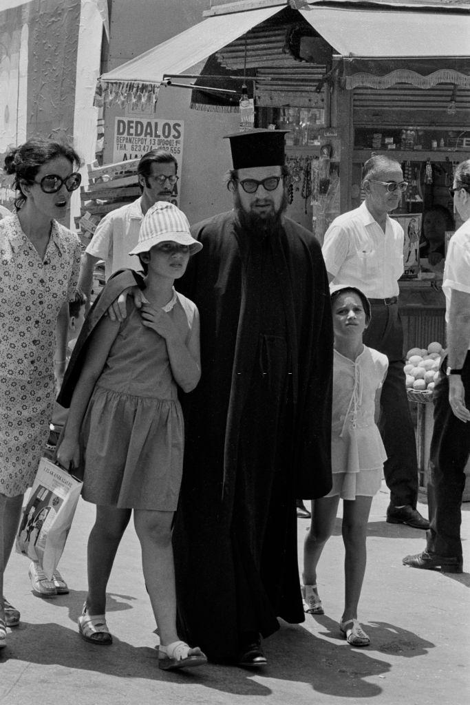 #2 Orthodox priest and his family on a street in Athens in July 1973, Greece.