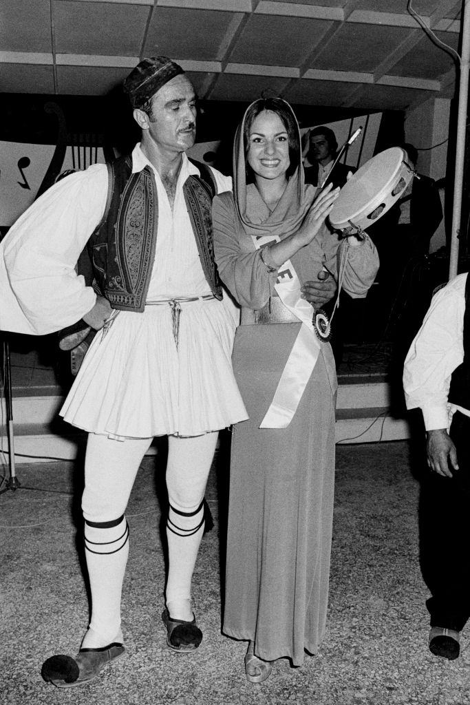 #36 Nadia Isabelle Krumacker in Athens with a dancer in traditional costume, 1973.