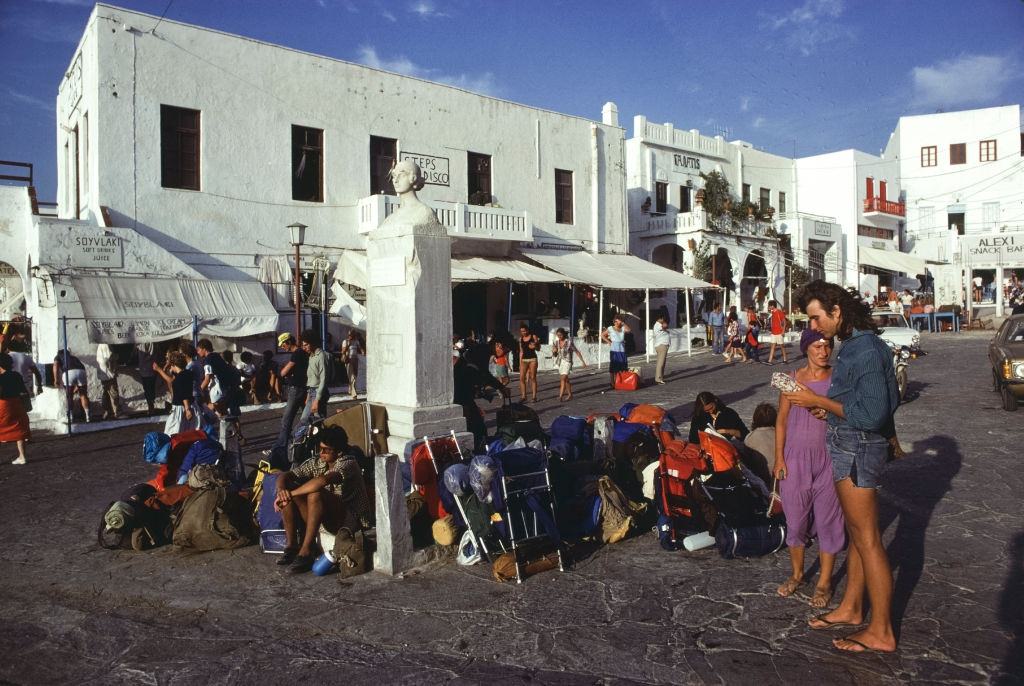 #65 Tourists in a small village square on the island of Mykonos, September 1978 .