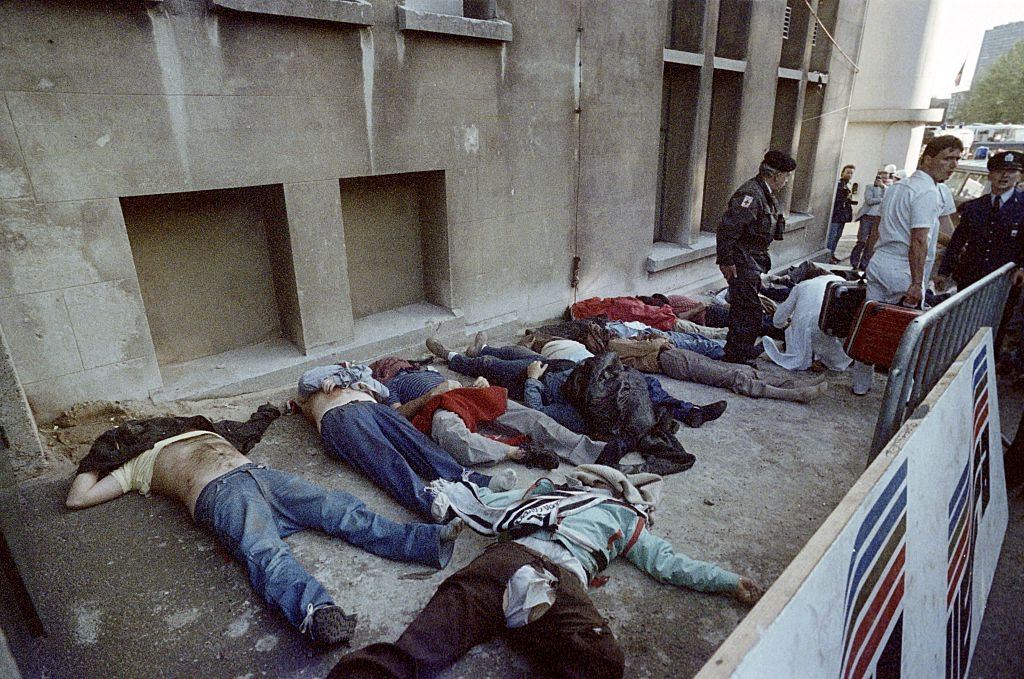 #72 Bodies of dead spectators are lying next to the stands after the violent incident happened on May 29, 1985 before the European Champion Clubs final.