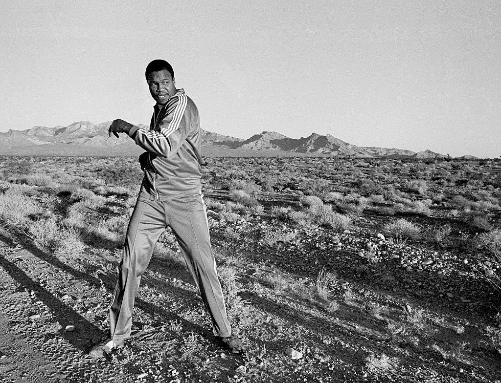 #49 Larry Holmes warming up before an early morning run in the desert outside Las Vegas, circa September 1980.
