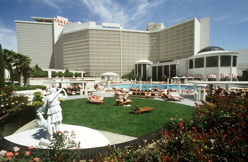 #17 Sunbathing lawn and pool on the outside of the Caesars Palace hotel casino in the Las Vegas, 1981.