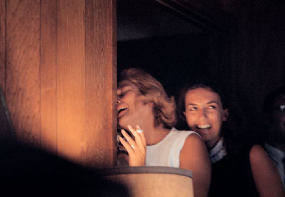 #4 Joan Aldrin (in white) expresses relief as she watches the television broadcast of her husband’s successful mission to the moon, Houston, Texas, July 1969.