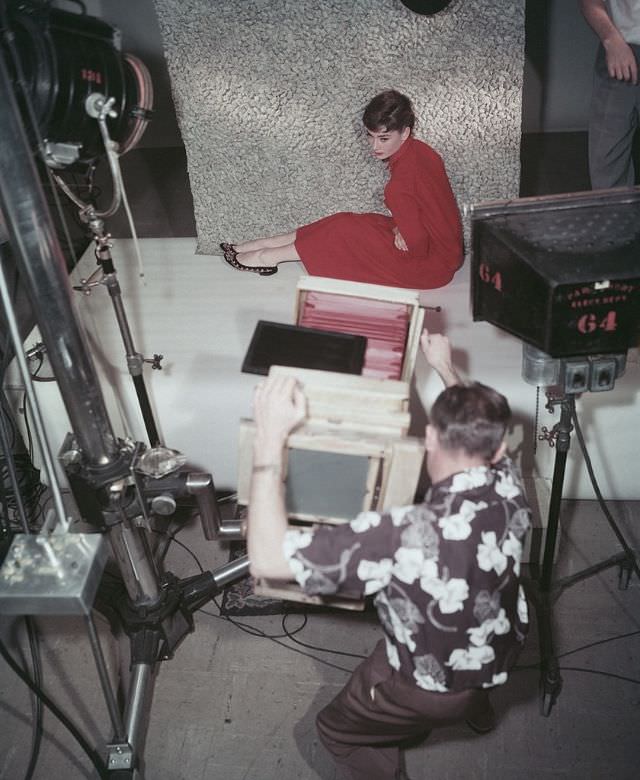 #10 Audrey Hepburn posing for a studio photographer, 1954.