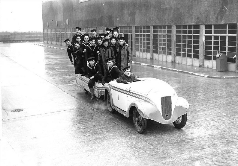 Navy recruits riding in car and trailer at the HMS Royal Arthur training centre formerly Butlin’s holiday camp, Skegness.