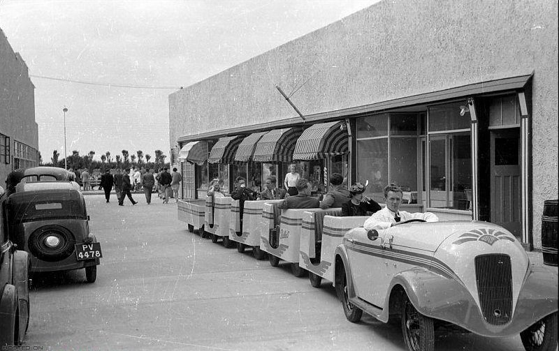 Holidaymakers riding the “train” at Butlin’s Holiday Camp, Skegness, Lincolnshire .