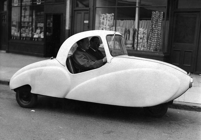A new “People’s Car”, with an entirely plastic body, designed to seat three adults and two children and marketed as the cheapest car on the road.