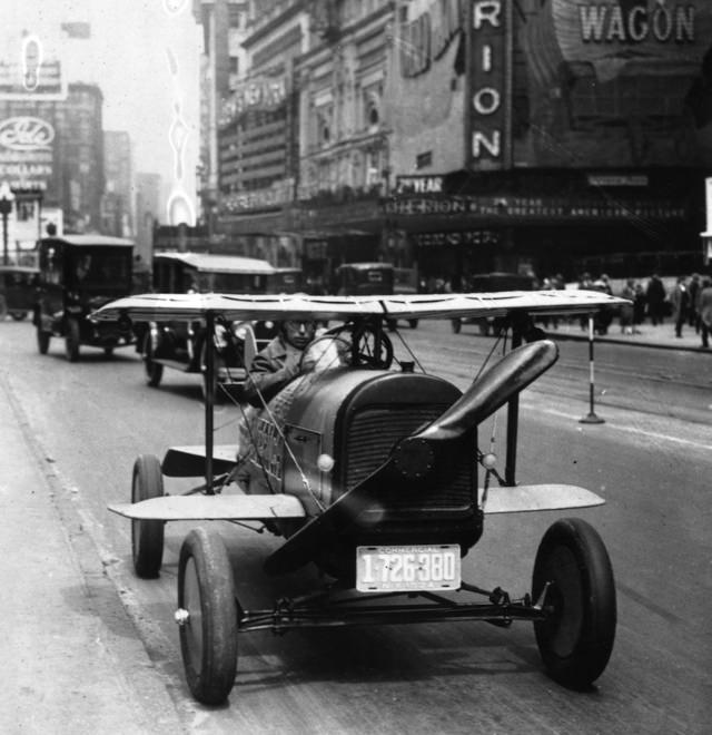 #45 A car with wings and a propeller on TImes Square, New York, 1924