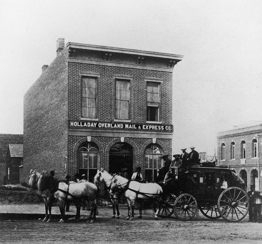 #17 View of a carriage parked outside the Holladay Overland Mail & Express, Denver, 1900.