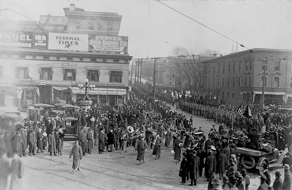 #20 A marching band leads a funeral procession in honor of Buffalo Bill.
