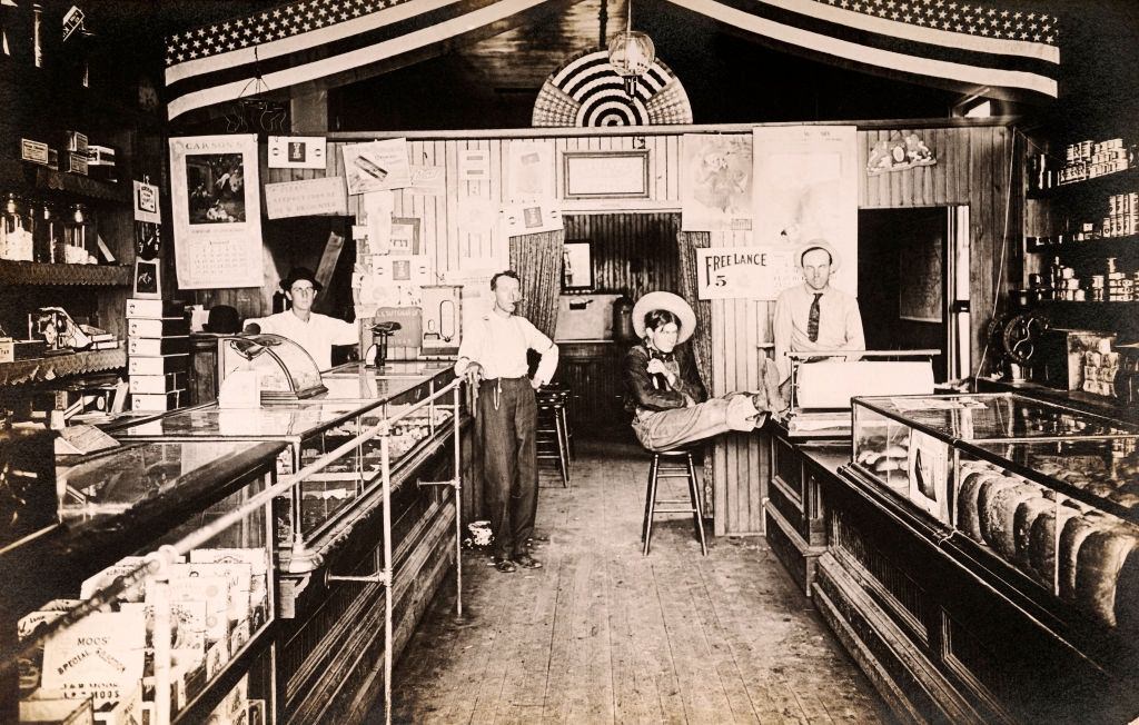 #7 General Store including shopkeepers, a customer and a cowboy, Denver, 1910.