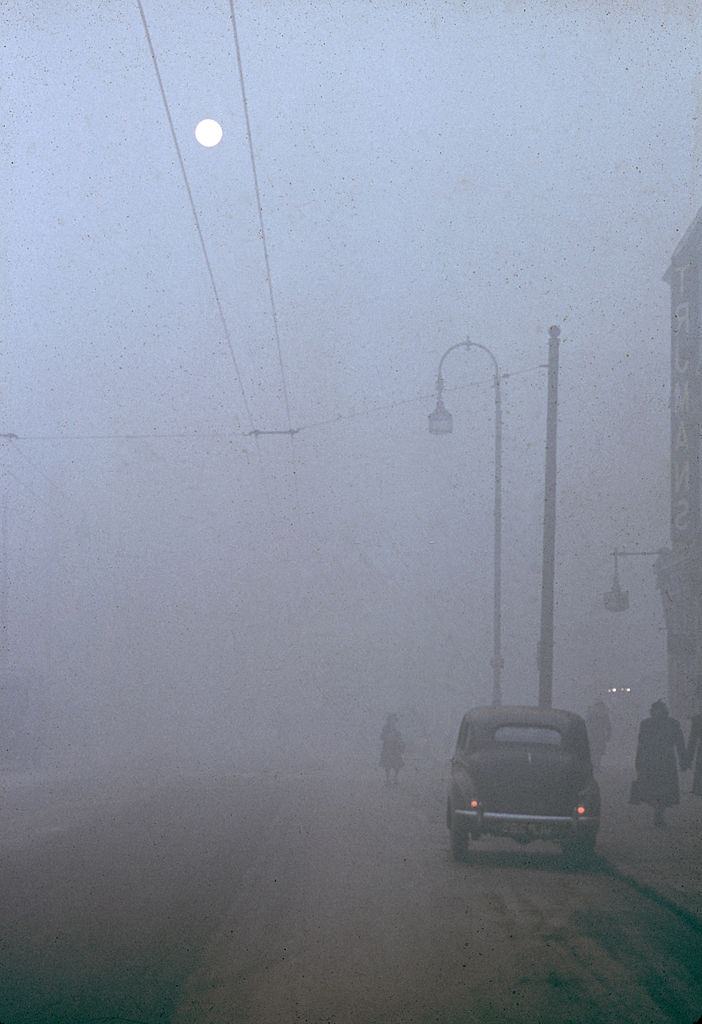 #11 Street scene on a foggy night near the London Pavillion cinema in Piccadilly Circus, London, 1952.