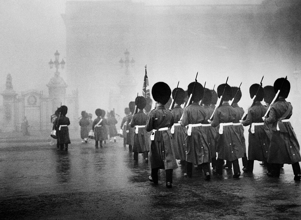 #26 Scots Guards march towards Buckingham Palace to take up sentry duty during the Great Smog of 1952.