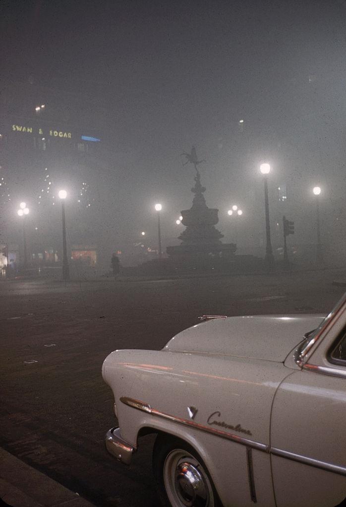 #3 View of a parked car near the Statue of Eros in Piccadilly Circus, London, 1952.
