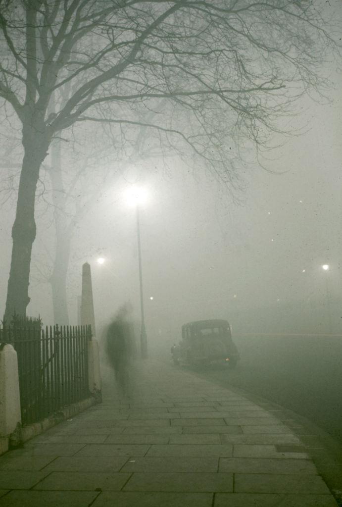 #2 View along a sidewalk in on a foggy night, London, 1952.