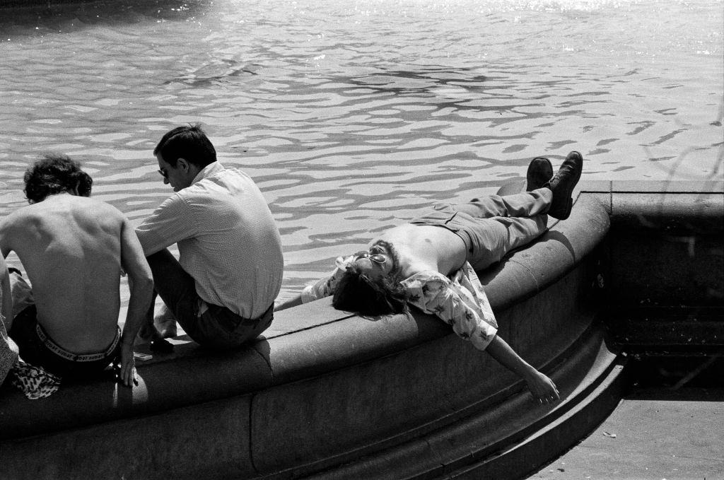 #29 A man relaxes in the sunshine in Trafalgar Square, London during the heatwave.