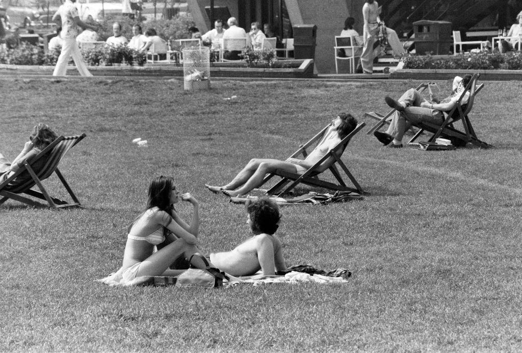 #38 Crowds flocked to sunbathe and relax in Hyde Park, London, 7th May 1976.