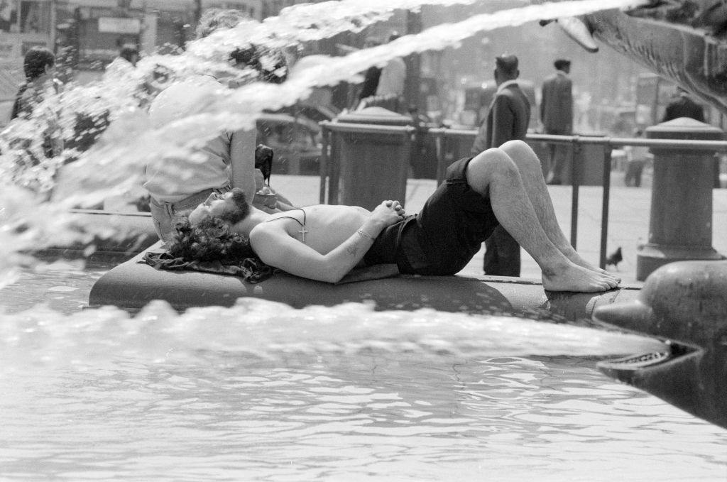 A man enjoying a fountain shower at Trafalgar Square, London, 8th June 1976.