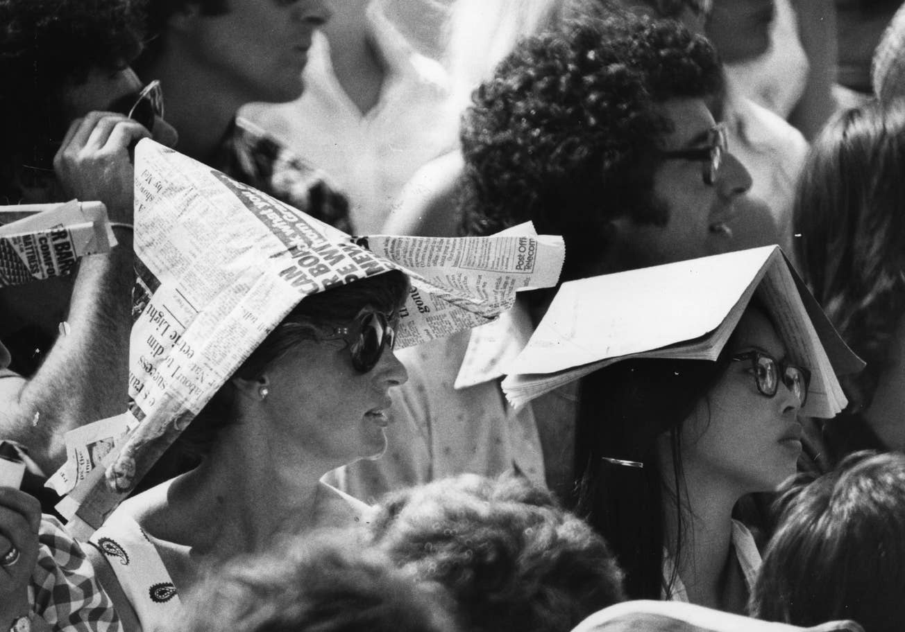 #5 Spectators at Wimbledon Tennis Championships protect themselves from the sun wearing newspaper hats