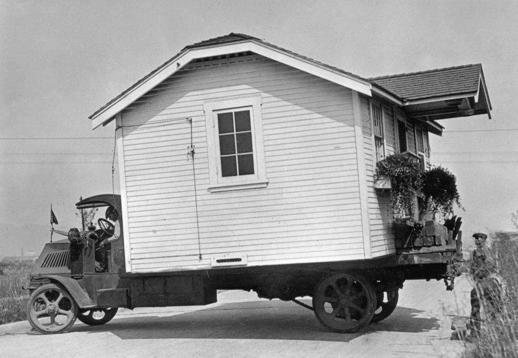 #9 A house moved from Hollywood is elevated to clear its new neighbor’s roof on East 90th Street. Aug. 31, 1958