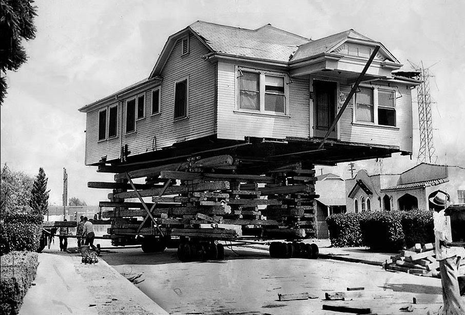 #2 A house being transported on the back of a truck in the LA city.