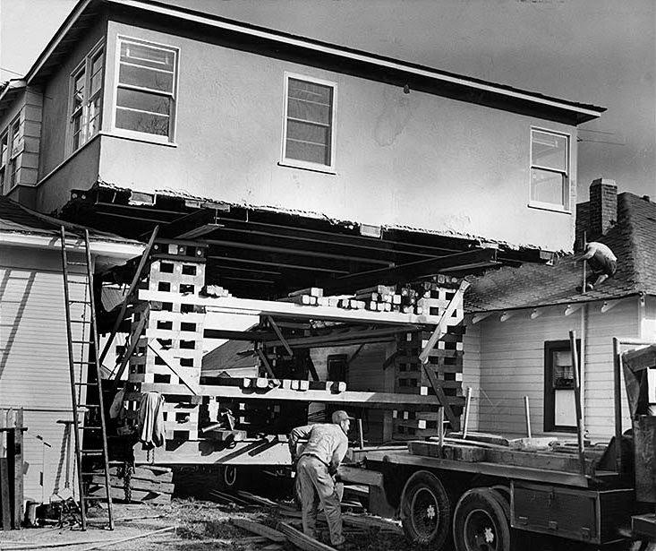 #10 A house is raised 25 feet to move into its new location on West 43rd Street. The structure was moved from 94th Street and El Manor Avenue. Jan. 8, 1959