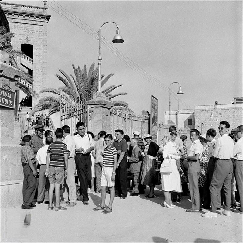 #30 People at the entrance to the bullring in Palma, 1956