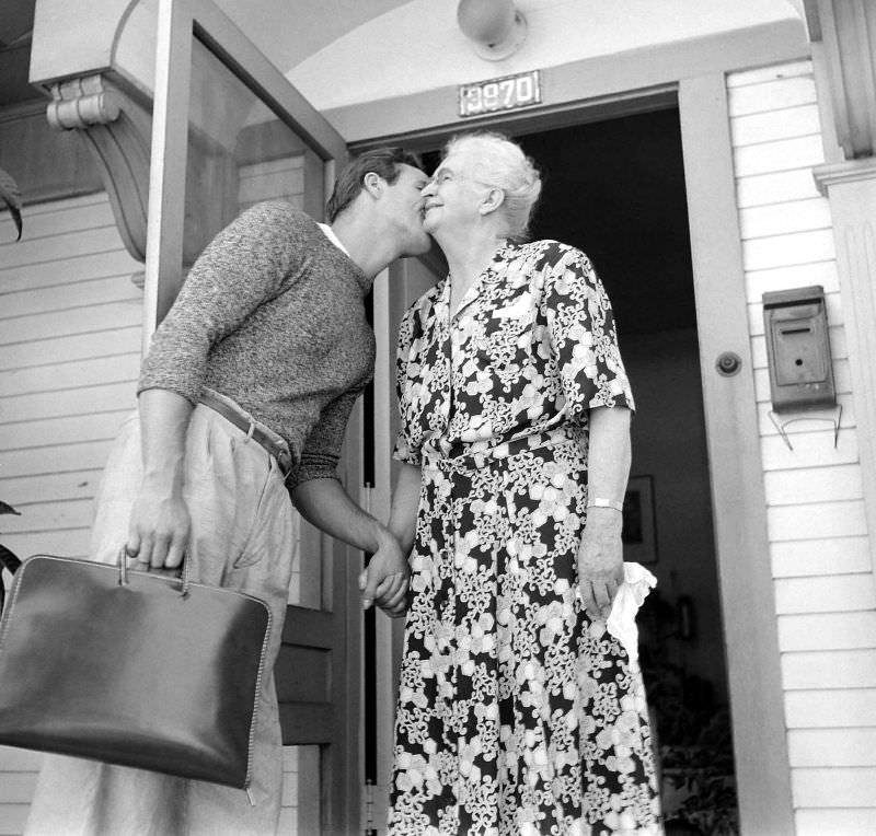 Marlon Brando kisses his grandmother as he heads to the studio for a day of filming ‘The Men,’ 1949.