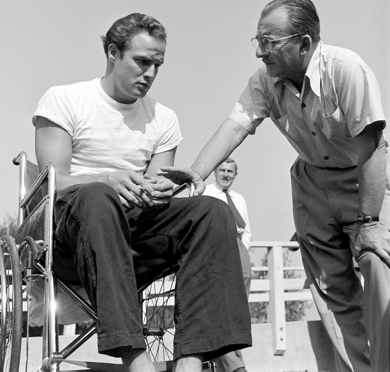 Marlon Brando chats with a production manager while training for his role in ‘The Men,’ 1949.