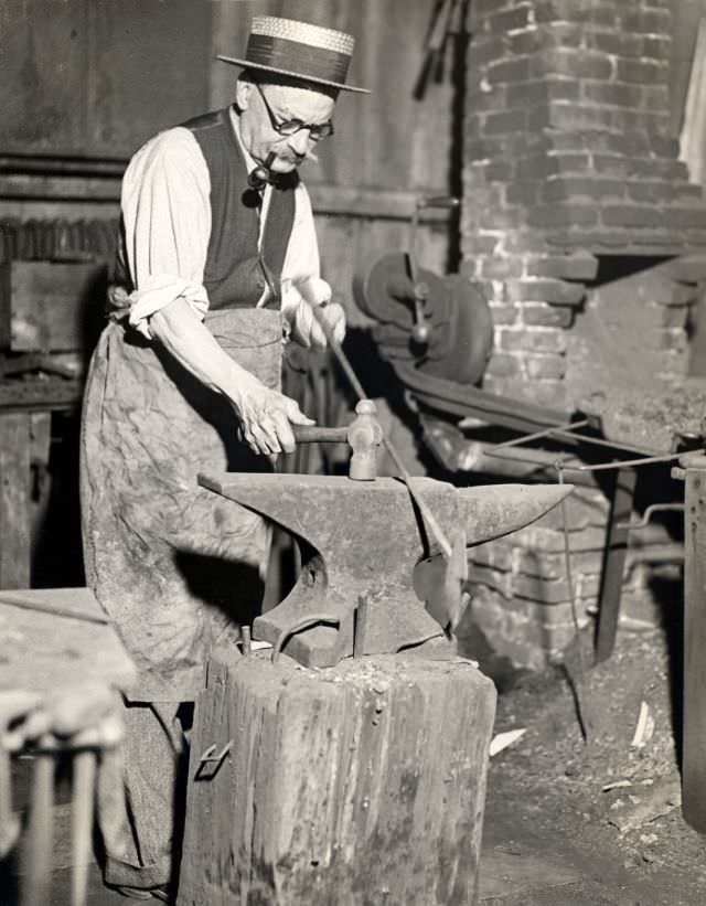 #20 Edward R. Cole, last of the shipsmiths, maker of whalecraft, at the old forge in Fairhaven, New Bedford, 1910s