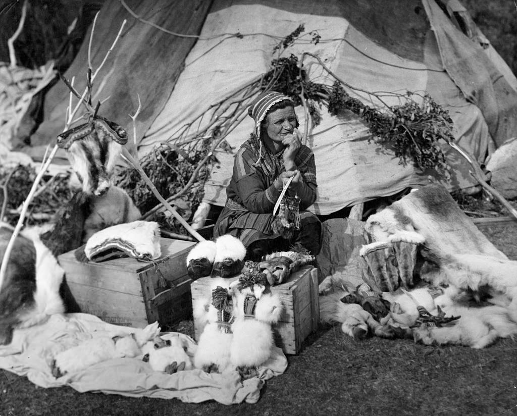 #41 An old Lapp Woman displays wares in Lyngseidet, Norway, 1955.
