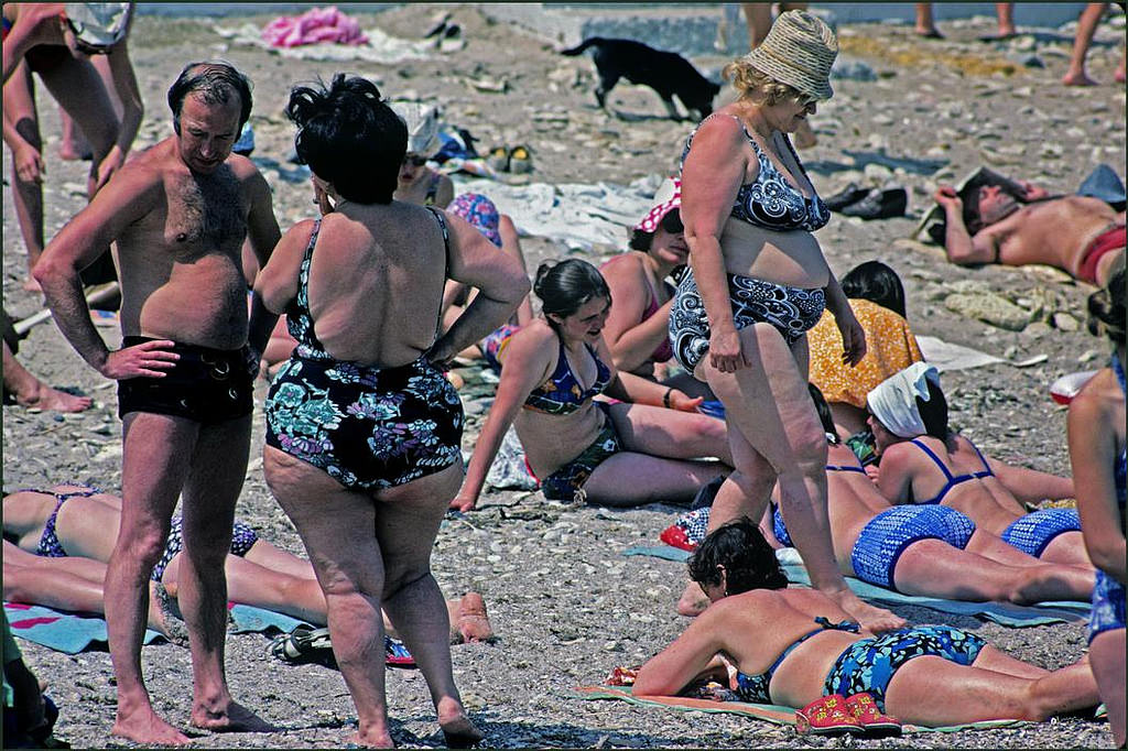 #6 A couple of stout ladies enjoy the sun amongst the beach crowd.