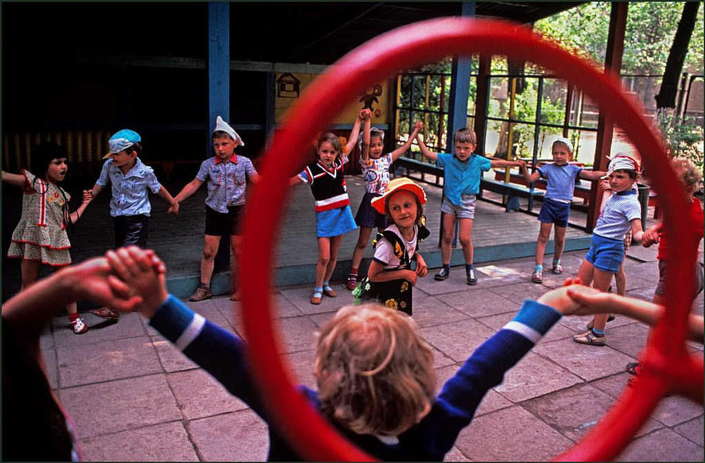 #34 Children playing the local version of “Ring a ring of roses” in a government kindergarten.