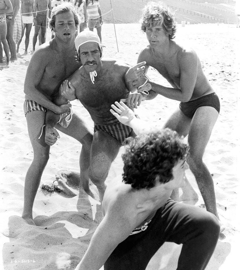 #6 Sam Elliott is held back from beach brawl by Parker Stevenson in a scene from the film ‘Lifeguard’, 1976.