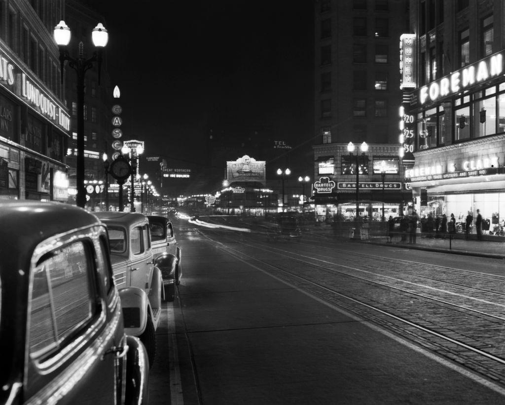 #6 Neon sign and parked cars along 4th Avenue Seattle, 1934.