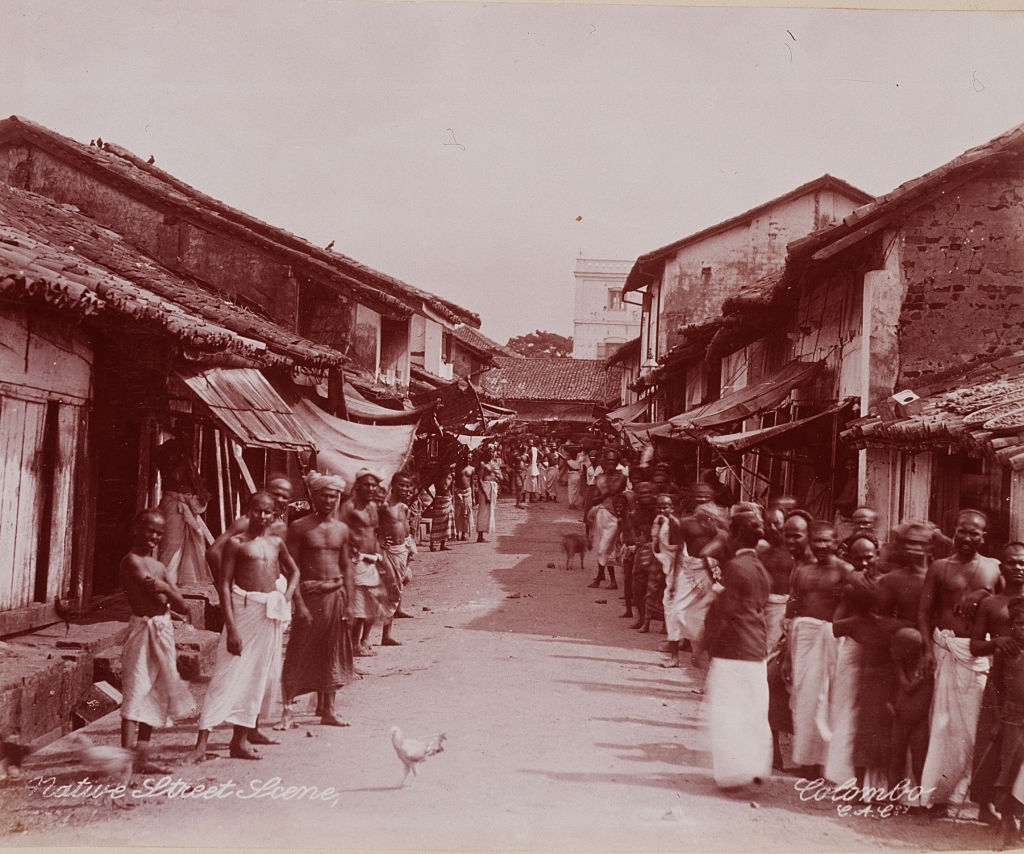 #43 Men line a narrow street in Ceylon, 1899.