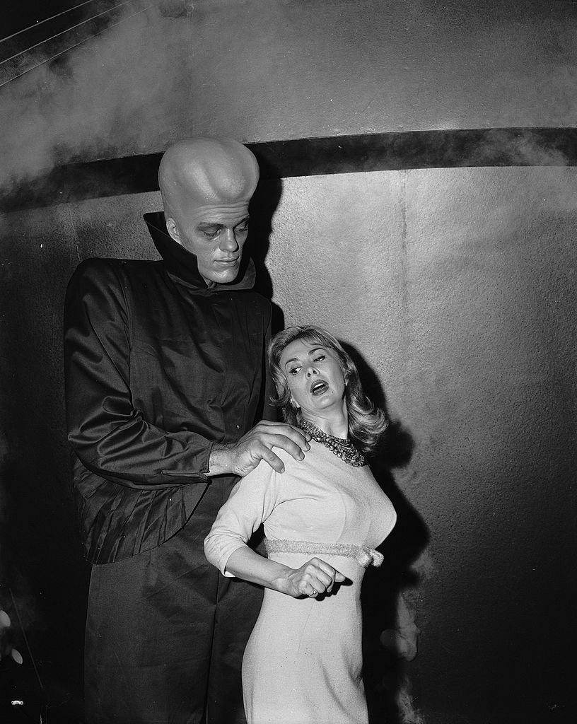 Richard Kiel grabs actress Susan Cummings from behind in a scene from the ‘To Serve Man’ episode of ‘The Twilight Zone,’ March 2, 1962.