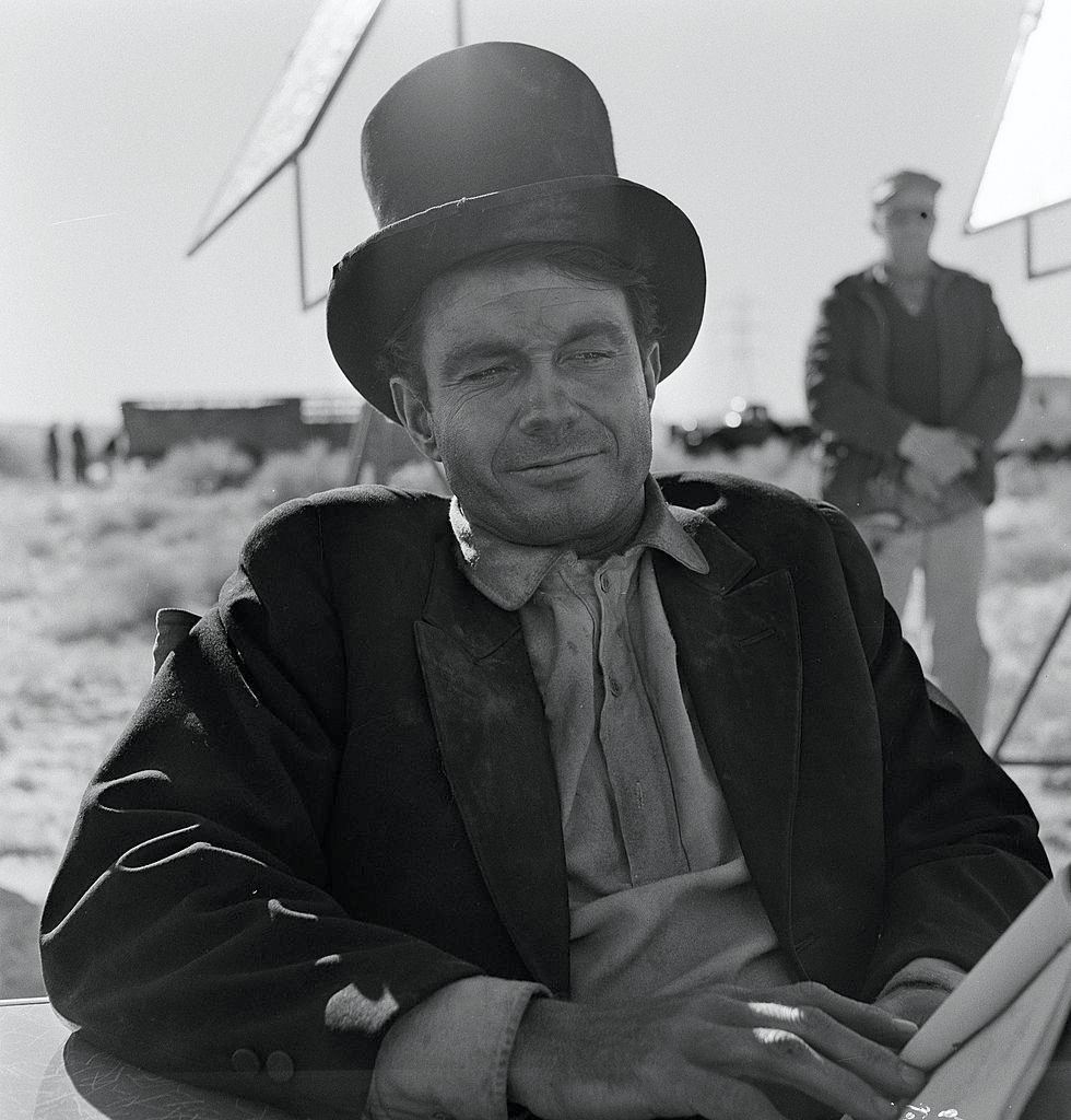 Cliff Robertson relaxes on the set of an episode of the television show ‘The Twilight Zone’ entitled ‘A Hundred Yards Over the Rim’, 1961.