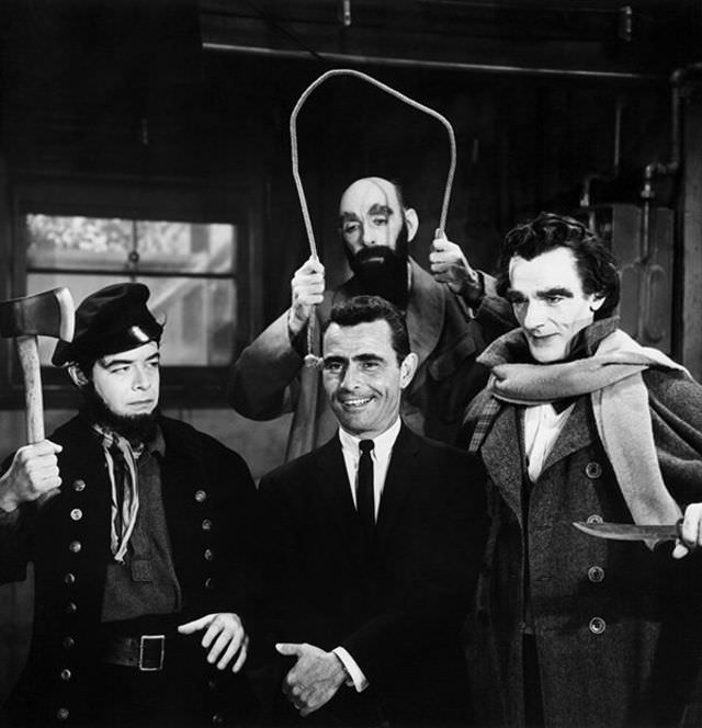 Serling cracks a smile surrounded by his sinistar stars in season four’s “The New Exhibit,” Robert Mitchell, Milton Parsons and David Bond.
