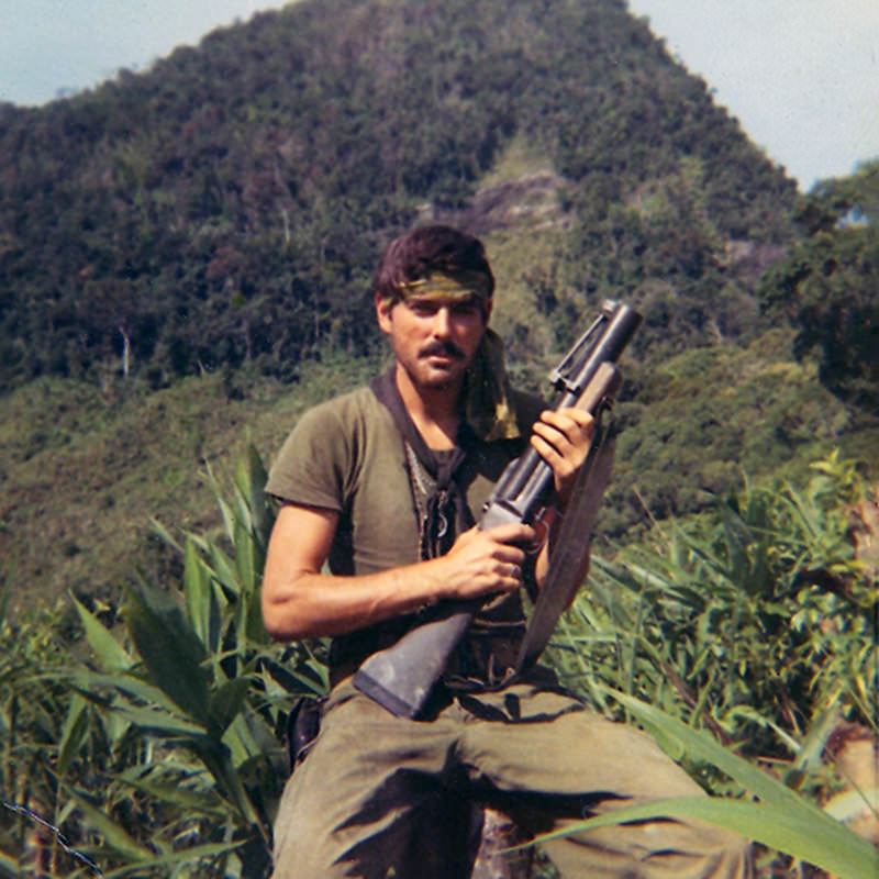 #16 Michael Patrick Eltrich in trees in the mountains west of L.Z. Stinson. June 11, 1970.